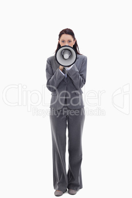 Businesswoman speaking in a megaphone