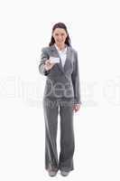 Smiling businesswoman showing a card