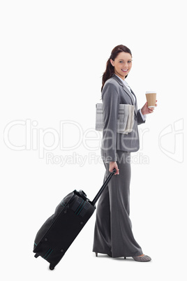 Profile of a businesswoman smiling going for a trip