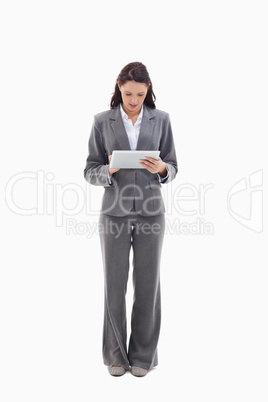 Businesswoman writing on a touch pad