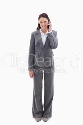 Smiling businesswoman using a phone