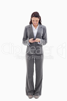 Businesswoman writing a text message