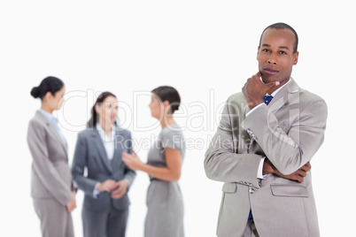 Thoughtful businessman with co-workers