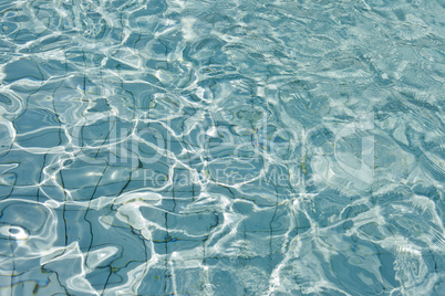 Most beautiful clear pool water reflecting in the sun
