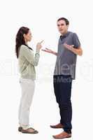 Man shrugged his shoulders is scolded by woman