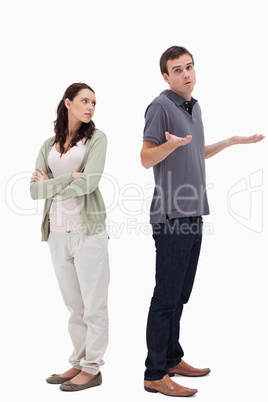 Man shrugged his shoulders back to back with angry woman