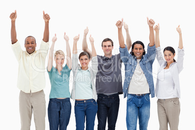 People raising their arms with the thumbs-up