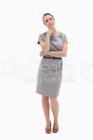Thoughtful woman posing in dress