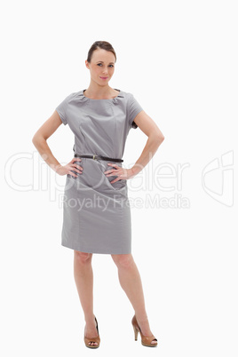 Woman posing in a dress with her hands on her hips