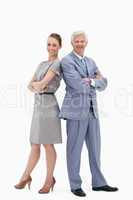 White hair businessman back to back with a woman and smiling