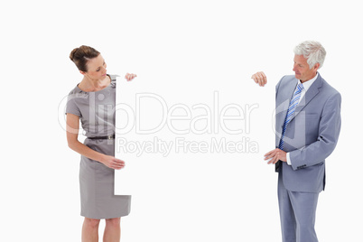 White hair businessman looking and holding a big white sign with