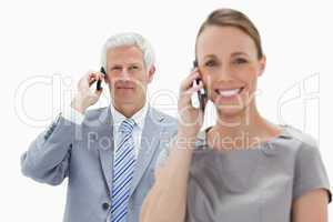 Close-up of a white hair businessman making a call with a smilin