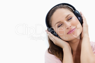 Close-up of a girl listening to music