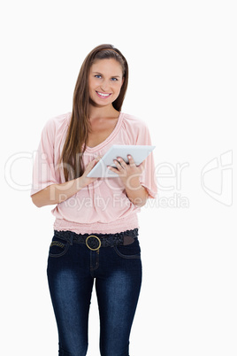 Smiling girl using a touchpad