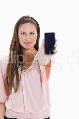 Close-up of a girl showing a smartphone