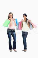 Girls smiling with shopping bags