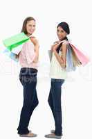 Girls smiling with a lot of shopping bags