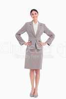 Smiling businesswoman with hands on her hip