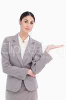 Young businesswoman with palm up