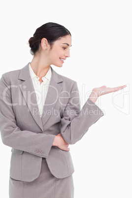 Young businesswoman looking at her palm