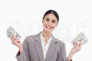 Smiling saleswoman with money in her hands
