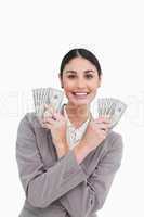 Smiling tradeswoman with money in her hands