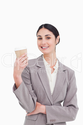 Smiling businesswoman with coffee in a paper cup