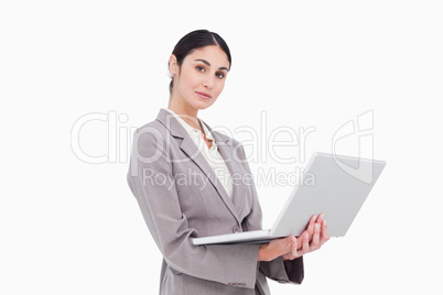 Side view of businesswoman with laptop