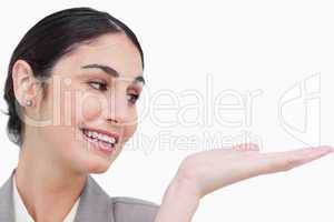 Close up of smiling businesswoman looking at her palm