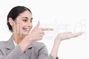 Close up of businesswoman pointing at her palm