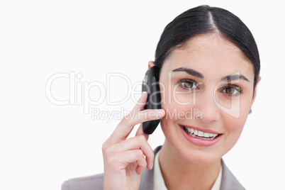 Close up of smiling businesswoman talking on cellphone