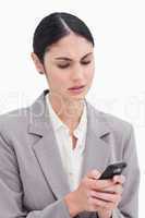 Close up of businesswoman confused by text message