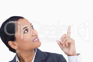 Close up of saleswoman looking and pointing up