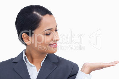 Close up of saleswoman looking at her palm