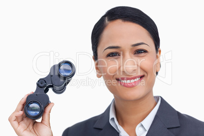 Close up of smiling saleswoman with spy glasses