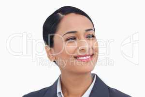 Close up of smiling saleswoman looking to the side