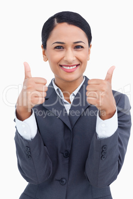 Close up of smiling saleswoman giving thumbs up