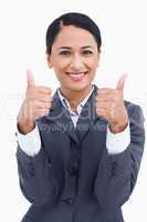 Close up of smiling saleswoman giving thumbs up