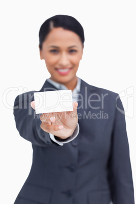 Close up of business card being shown by saleswoman