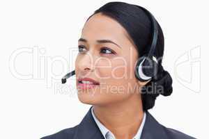 Close up of talking call center agent looking to the side