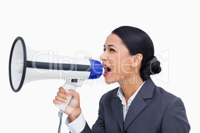 Close up of saleswoman yelling through megaphone