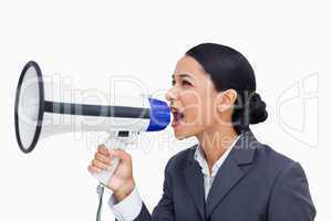 Close up of saleswoman yelling through megaphone
