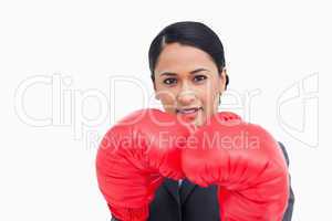 Close up of confident saleswoman with boxing gloves