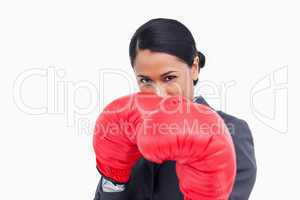 Close up of aggressive saleswoman with boxing gloves