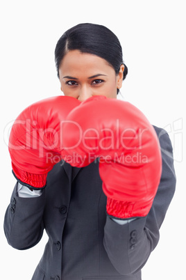 Close up of belligerent saleswoman with boxing gloves
