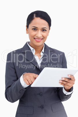 Close up of saleswoman using touch screen computer