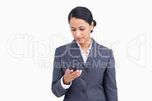 Close up of saleswoman writing text message