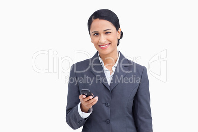 Close up of smiling saleswoman holding cellphone