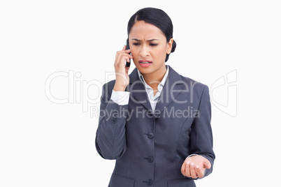 Close up of angry saleswoman in phone conversation