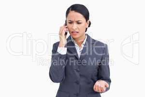 Close up of angry saleswoman in phone conversation